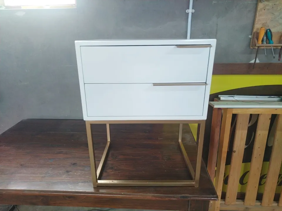 White two-drawer bedside pedestal on a gold metal frame