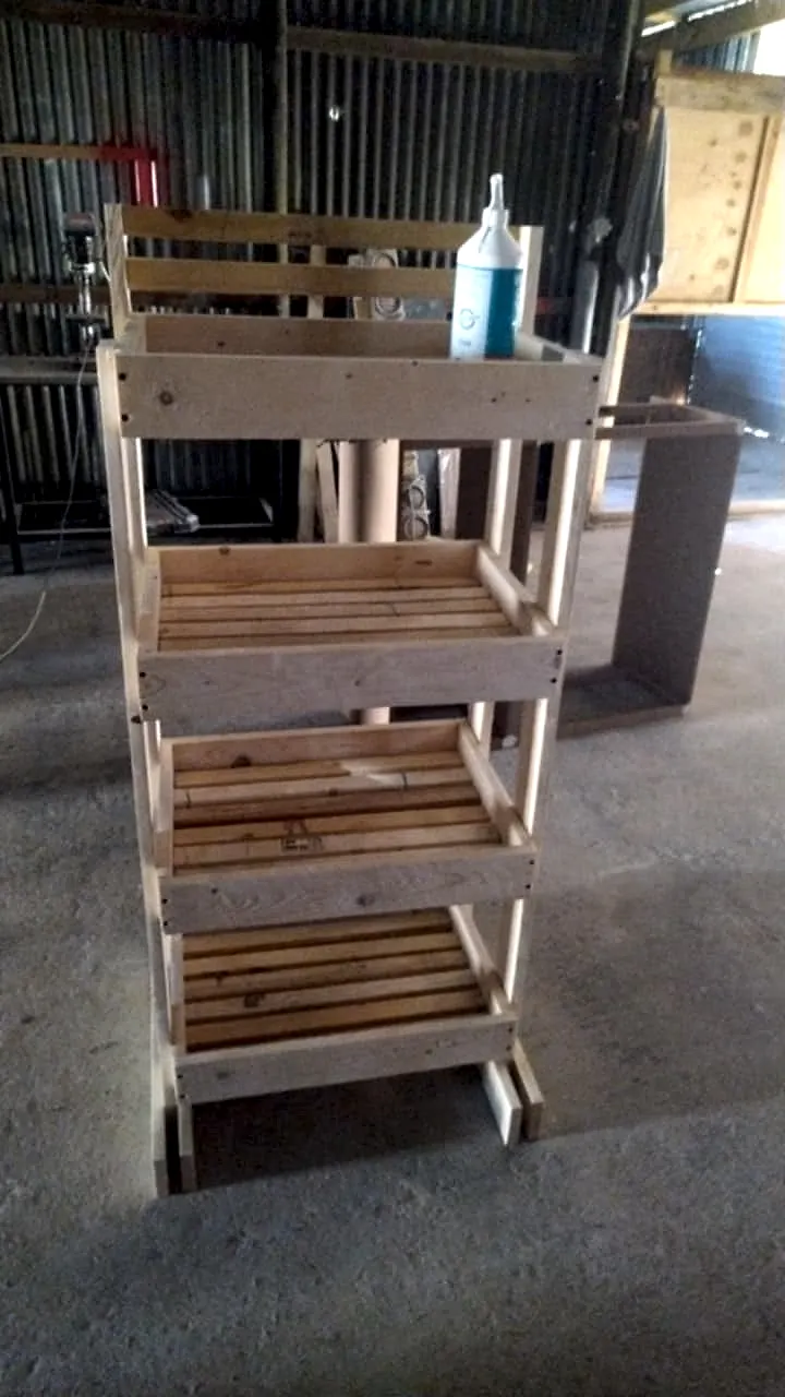 Four-tier slatted timber shelf rack with open slatted shelves on a tall frame