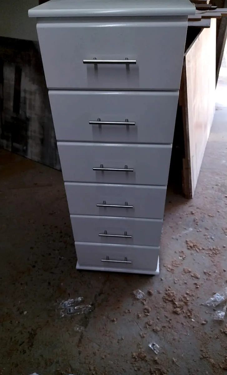 Tall narrow pale grey tallboy chest with six drawers and silver bar handles