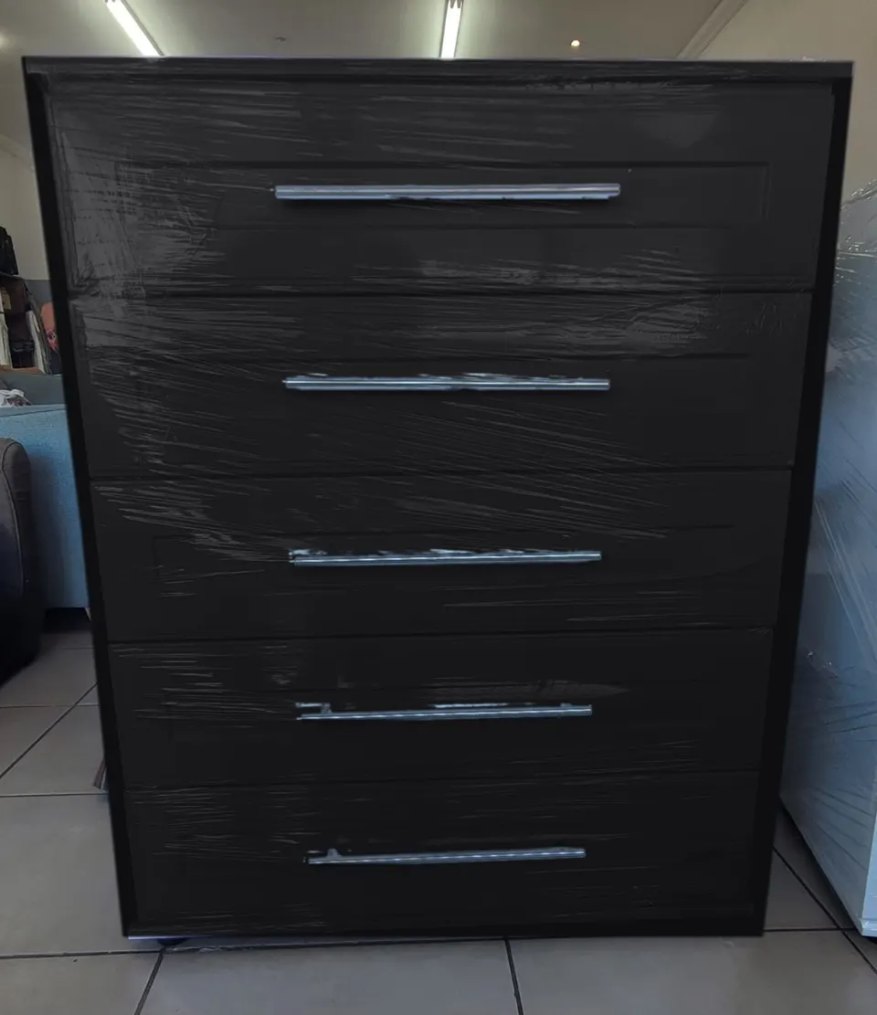 Black five-drawer chest of drawers with raised-panel drawer fronts and full-length silver bar handles (colour preview)